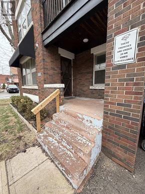 Hamilton (Crown Point) multi-family for rent - A room with two windows and a wooden floor.