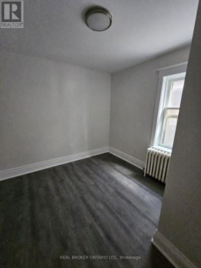 Hamilton (Crown Point) multi-family for rent - A room with a window and a radiator on the wall.