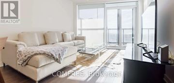 Toronto (Niagara) condo for rent - A living room with a couch and a television.