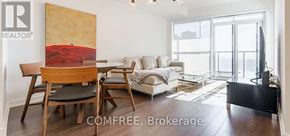 Toronto (Niagara) condo for rent - A living room with a couch, chair, and a painting on the wall.