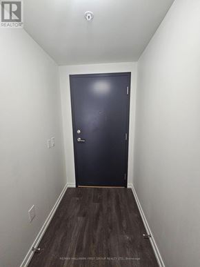 Toronto (Bayview Woods-Steeles) condo for rent - A white door with a black handle and lock.