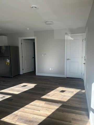 Dartmouth apartment for rent - A kitchen with a refrigerator and a wooden floor.