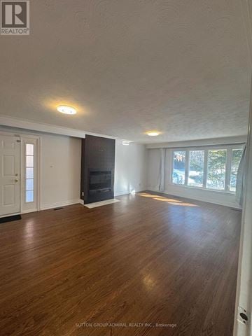 Toronto (Newtonbrook West) house for rent - A kitchen with wooden cabinets and a stainless steel refrigerator.