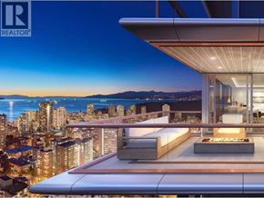 Vancouver apartment for rent - A modern building with a balcony overlooking a cityscape at dusk.