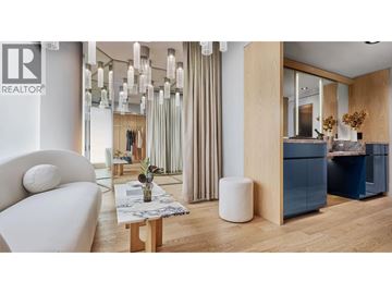 Vancouver apartment for rent - A modern living room with a white sofa and a wooden coffee table.