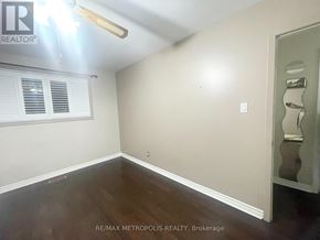 Toronto (Centennial Scarborough) house for rent - A room with a window and a door is shown.