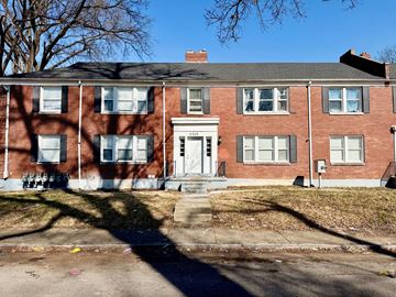 Louisville apartment for rent - A red brick house with a white door and windows.