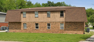 Mount Zion apartment for rent - A brown building with a brown roof and four windows.