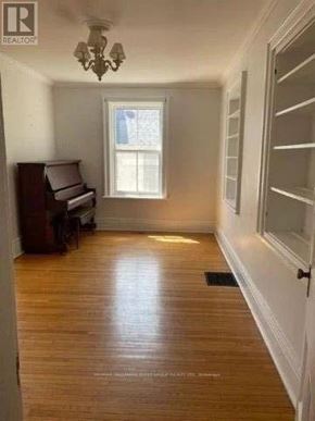 Cobourg house for rent - A room with a piano and a window.