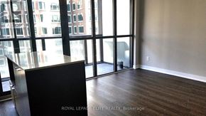 Toronto (Church-Yonge Corridor) condo for rent - A room with a large window overlooking a cityscape.