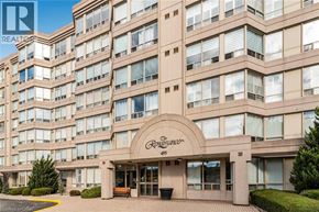 Stoney Creek condo for rent - The front of a building with the sign "The Raysander" and the number 495 on it.
