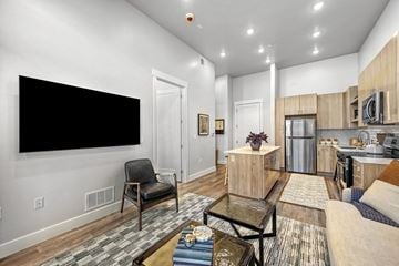 Midvale apartment for rent - A living room with a black chair and a black table.
