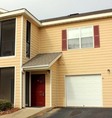 Auburn apartment for rent - A house with a red door and a white garage door.
