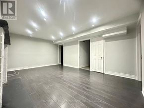 Mississauga (Creditview) house for rent - A kitchen with white appliances and cabinets.