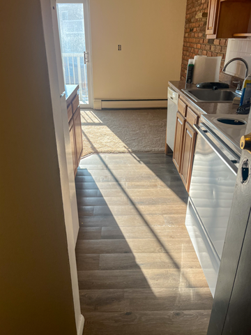 Willoughby apartment for rent - A kitchen with a sink and a window.