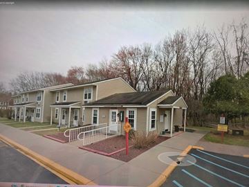 Port Jervis apartment for rent - A building with a red stop sign in front of it.