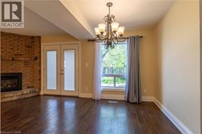 Thorold townhouse for rent - A kitchen with black appliances and white cabinets.