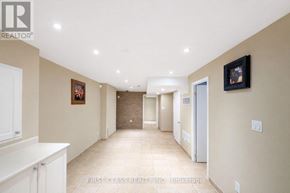 Markham (Rouge River Estates) house for rent - A hallway with a white cabinet on the left and a framed picture on the wall.
