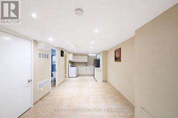Markham (Rouge River Estates) house for rent - A spacious kitchen and living room with a white door on the left.