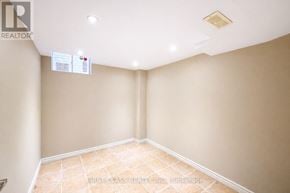 Markham (Rouge River Estates) house for rent - A room with a tiled floor and a ceiling with a light fixture.