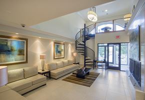 Haverstraw apartment for rent - a living room with a spiral staircase in a house