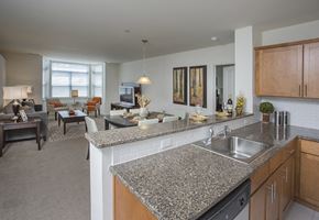 Haverstraw apartment for rent - a kitchen with granite countertops and a view of a living room