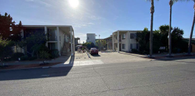 San Diego apartment for rent - A sunny day in a quiet residential street with a car parked on the side.