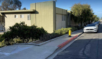 San Diego apartment for rent - A white car is parked on the side of a street.