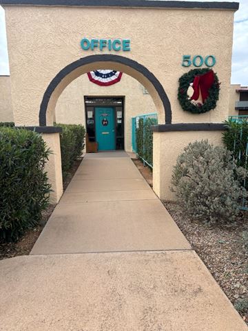 Sierra Vista apartment for rent - A pathway leads to a door under a sign that says Office 500.