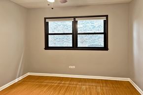 Forest Park apartment for rent - A room with a window and wooden flooring.