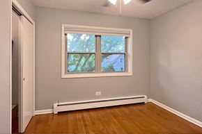 Forest Park apartment for rent - A room with a window and a white radiator on the floor.