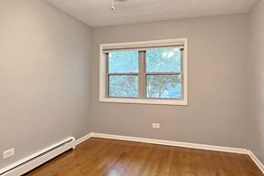 Forest Park apartment for rent - A room with a window and a radiator on the floor.