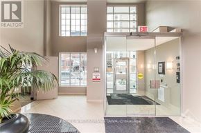 Ottawa condo for rent - A realtor office with glass doors and a plant.