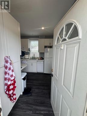 London North (North N) triplex for rent - A white door is on the right side of the image.