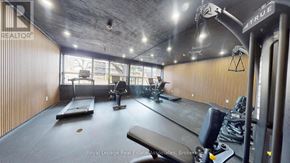 Toronto (Englemount-Lawrence) multi-family for rent - A gym with treadmills, weights, and exercise equipment.