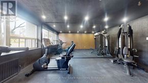 Toronto (Englemount-Lawrence) multi-family for rent - A gym with a variety of equipment including treadmills, weights and exercise machines.