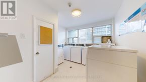 Toronto (Englemount-Lawrence) multi-family for rent - A white laundry room with a washer and dryer.