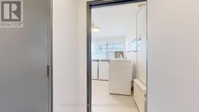 Toronto (Englemount-Lawrence) multi-family for rent - A white door with a Realty sign on it.
