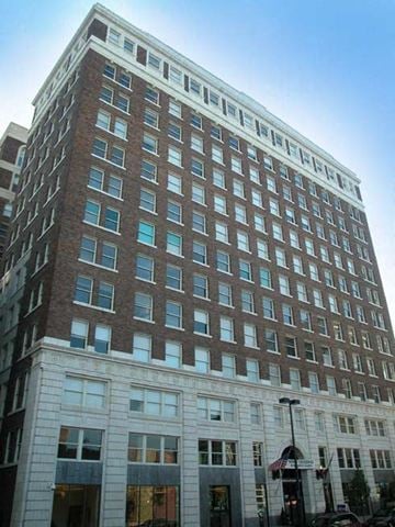 Kansas City apartment for rent - a tall building with a street in front of it