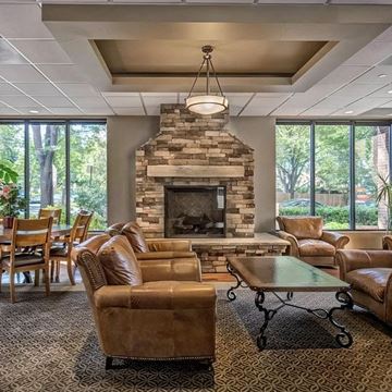 Denver apartment for rent - a living room with couches and chairs and a fireplace