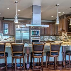 Denver apartment for rent - a kitchen with a bar and chairs