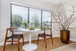 Denver apartment for rent - a dining room with a table and chairs and a window