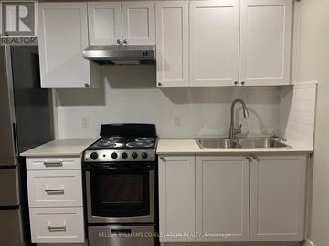 Hamilton (Stipley) other for rent - A white kitchen with a stove and cabinets.