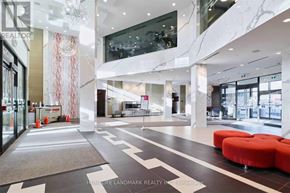 Toronto (Henry Farm) condo for rent - A lobby with a marble floor and a glass wall.
