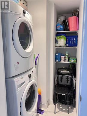 Toronto (Henry Farm) condo for rent - A laundry room with a washer and dryer stacked on top of each other.
