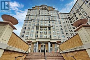 Hamilton (Corktown) condo for rent - A tall building with a balcony in front of it.