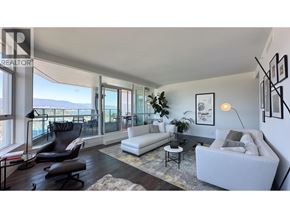 Vancouver apartment for rent - A living room with a white couch and a black chair.