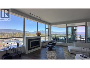 Vancouver apartment for rent - A living room with a fireplace and a view of the mountains.