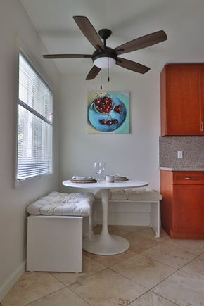 Mountain View apartment for rent - a dining room with a table and a ceiling fan