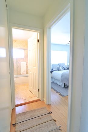 Mountain View apartment for rent - a bedroom with a door open to a bathroom and a bed